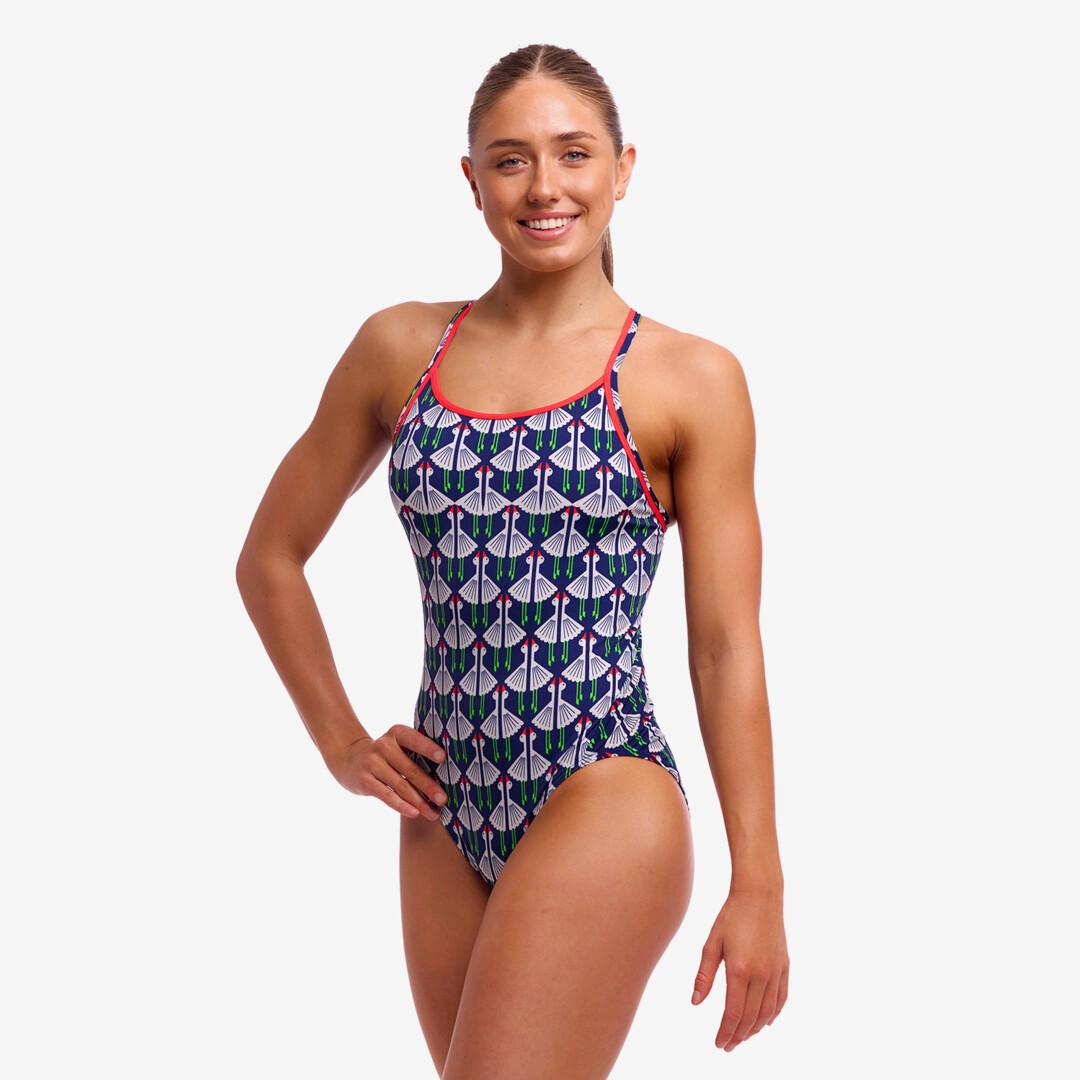 woman wearing funkita diamond back swimsuit, sitting duck pattern