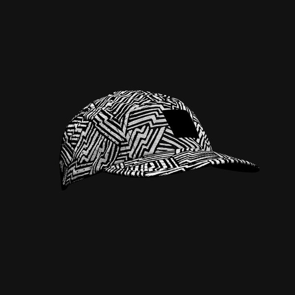 Black running cap from SAYSKY with 360 reflective fabric showing glow in the dark
