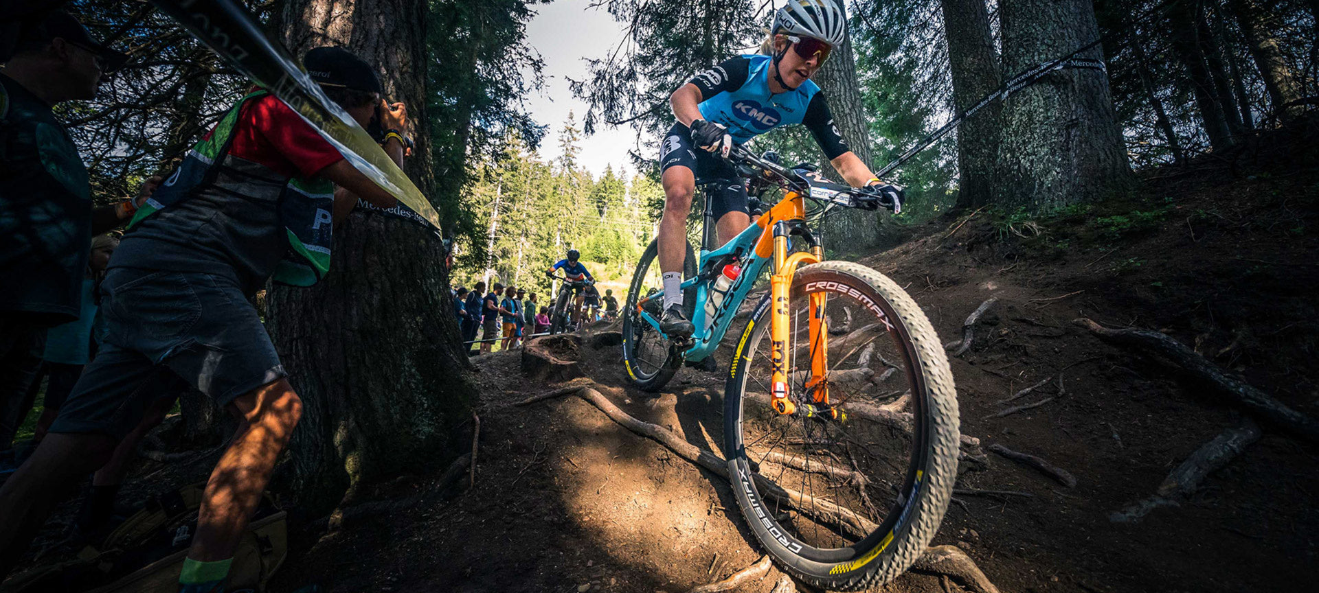 blue orbea cross country xc bike heading down a muddy trail also great for uphill racing