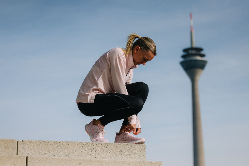 Woman wearing New Balance Long Sleeve Run Top