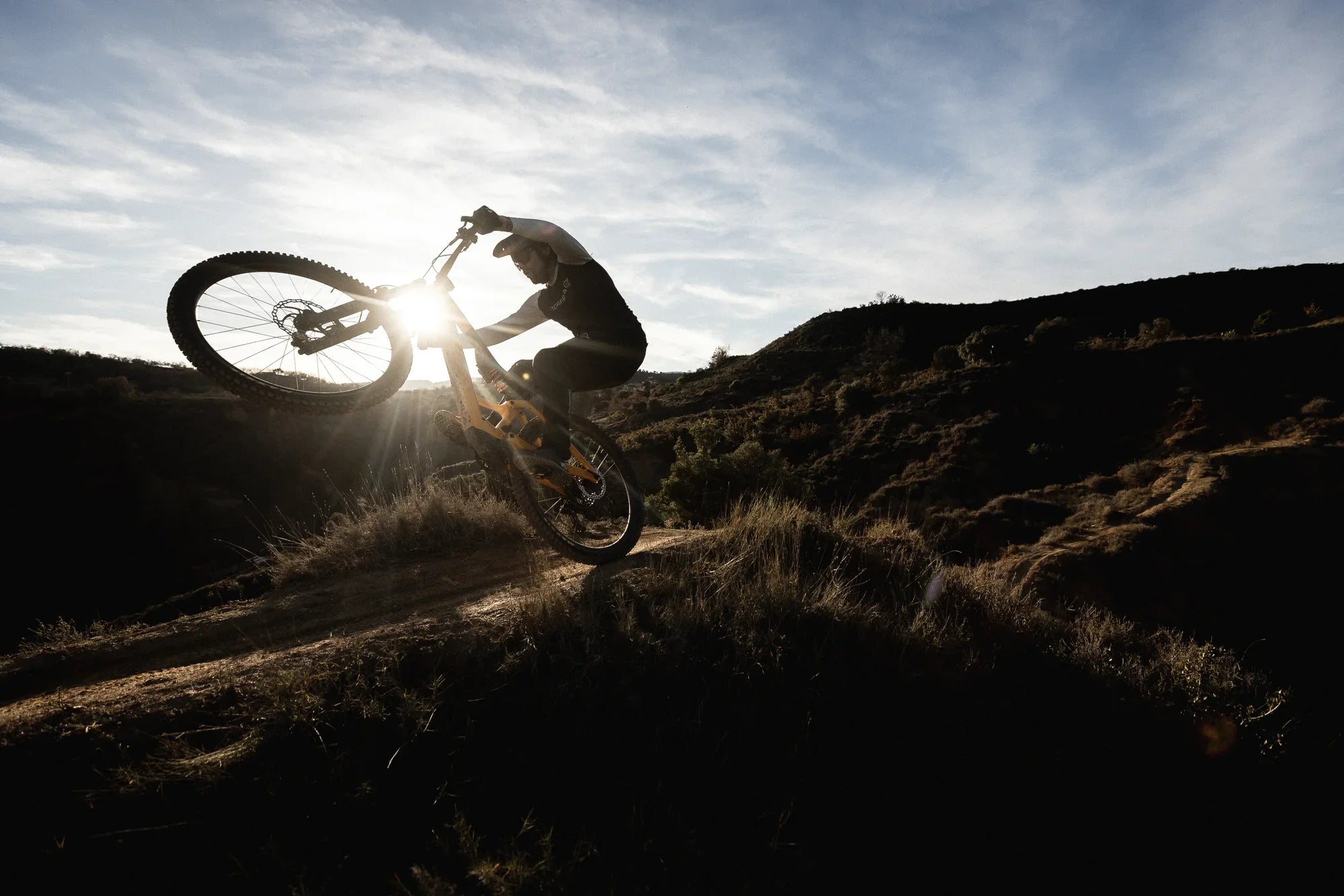 guy riding an orbea mountain bike
