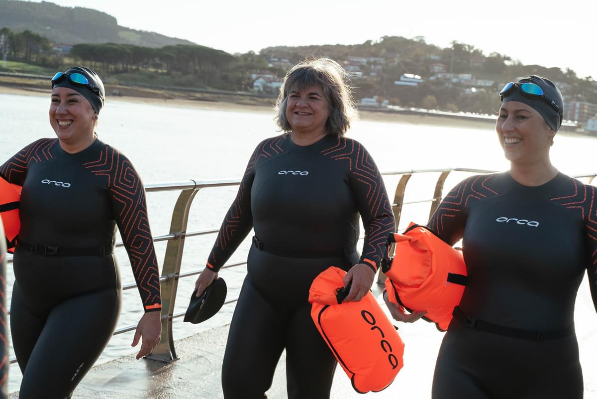women by the sea wearing orca vitalis trn entry level wetsuits for open water swimming
