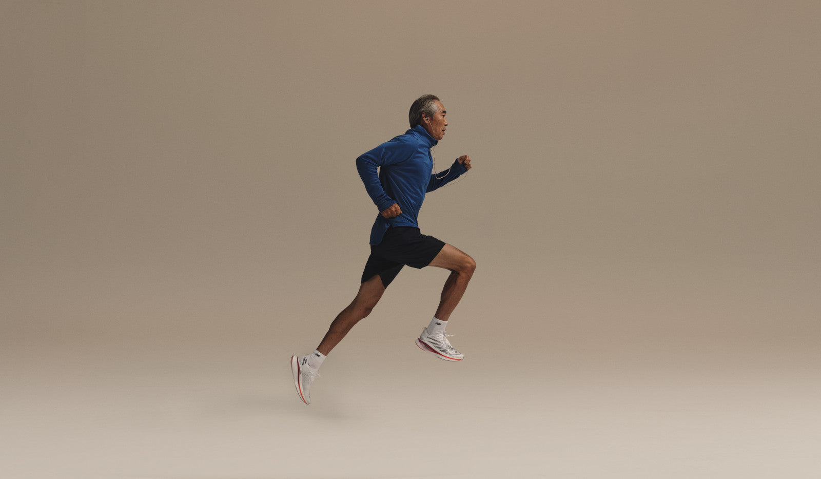man running in new balance - road and trail running gear at The Sports Room for men