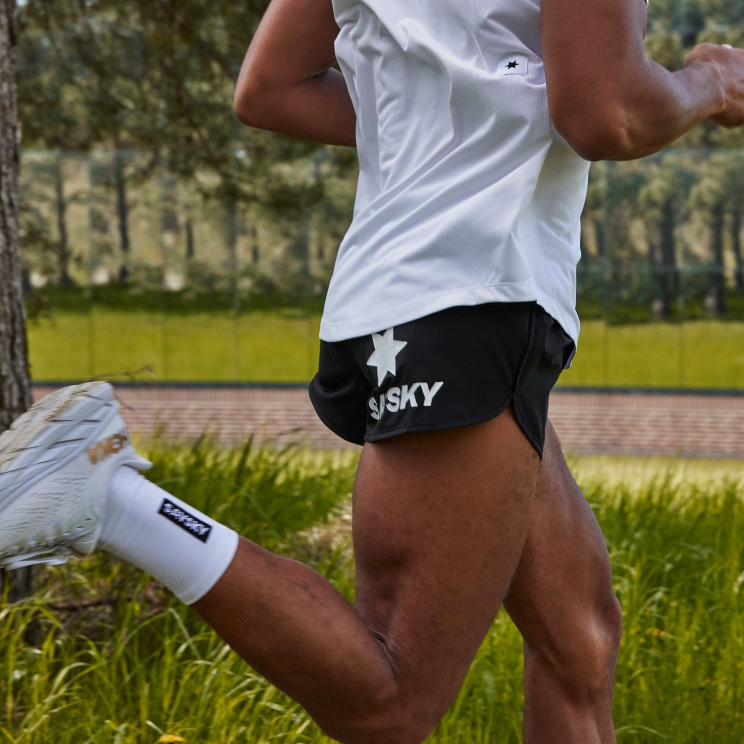 man running in black SAYSKY run shorts