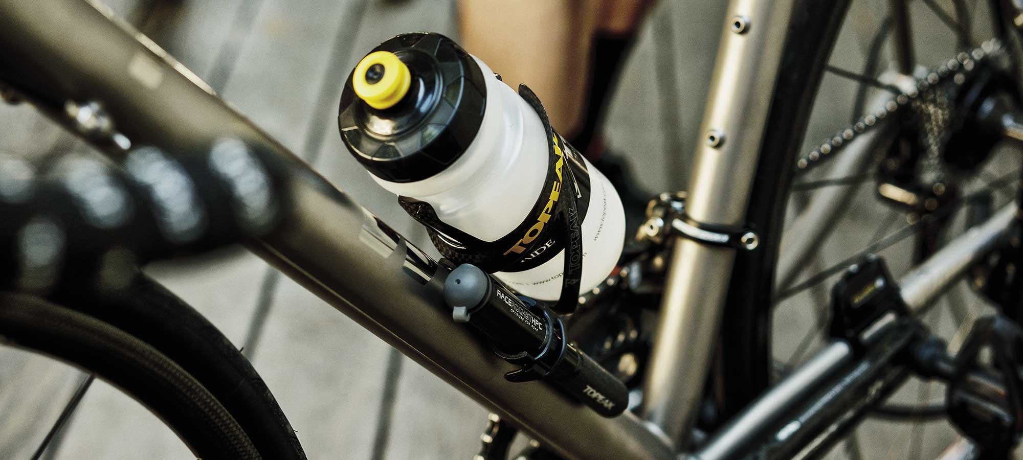 bike bottle mounted in bike cage securely attached to bicycle frame