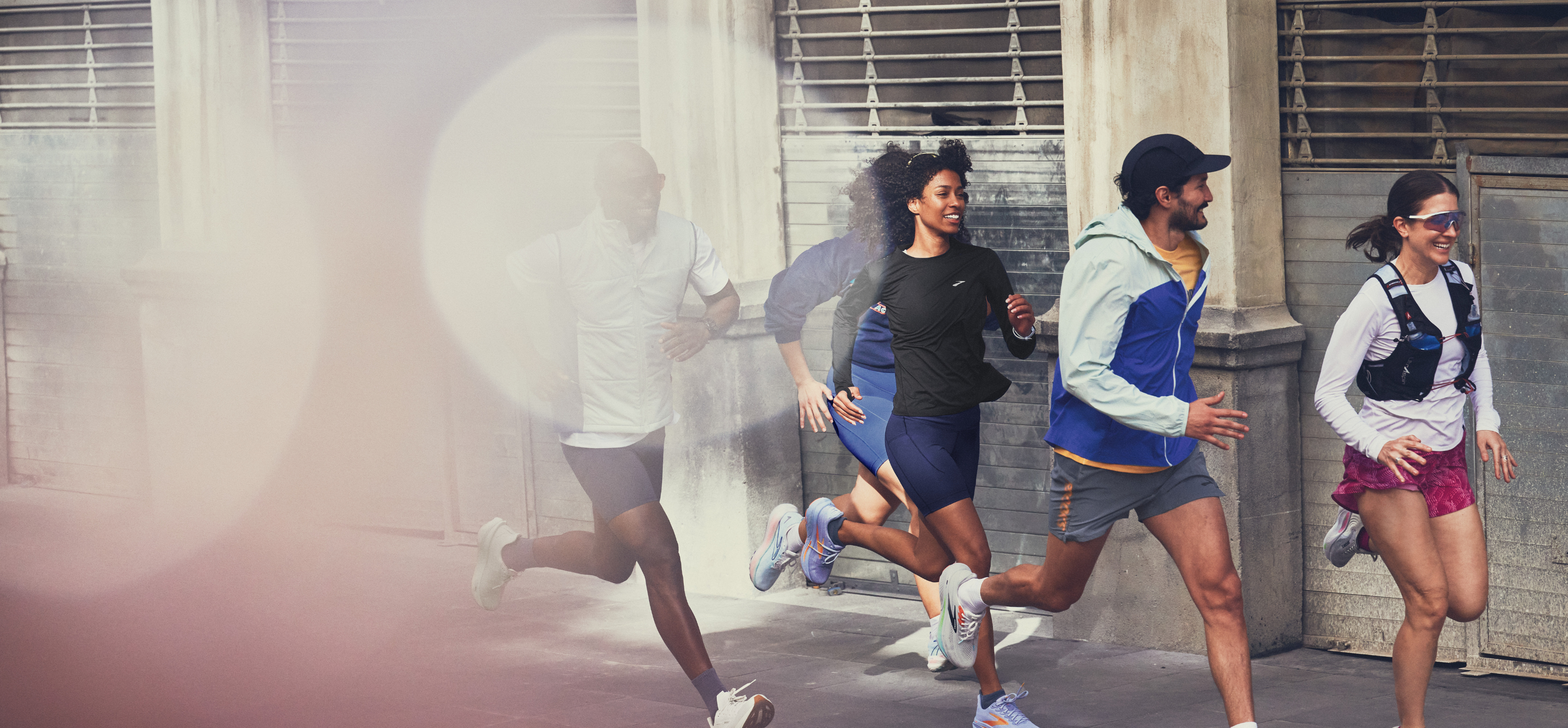 men and women running in Brooks run gear