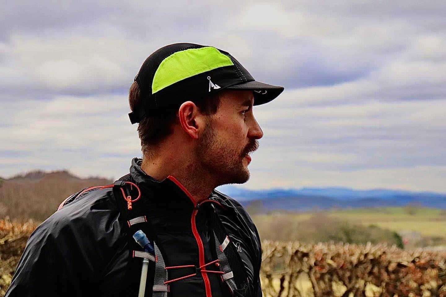 man wearing vaga running cap