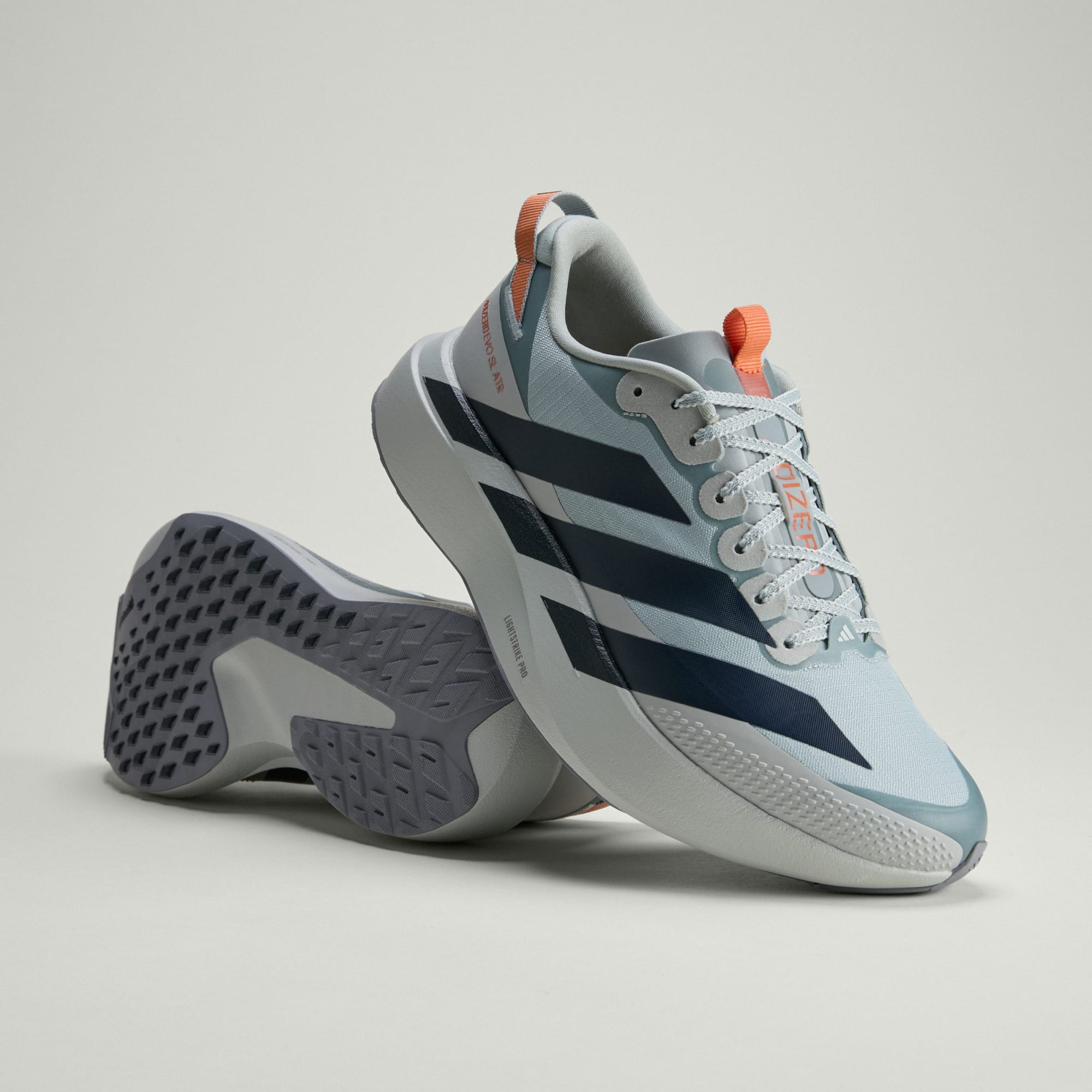 pair of adidas adizero evo sl all terrain run shoes showing top and sole of shoes