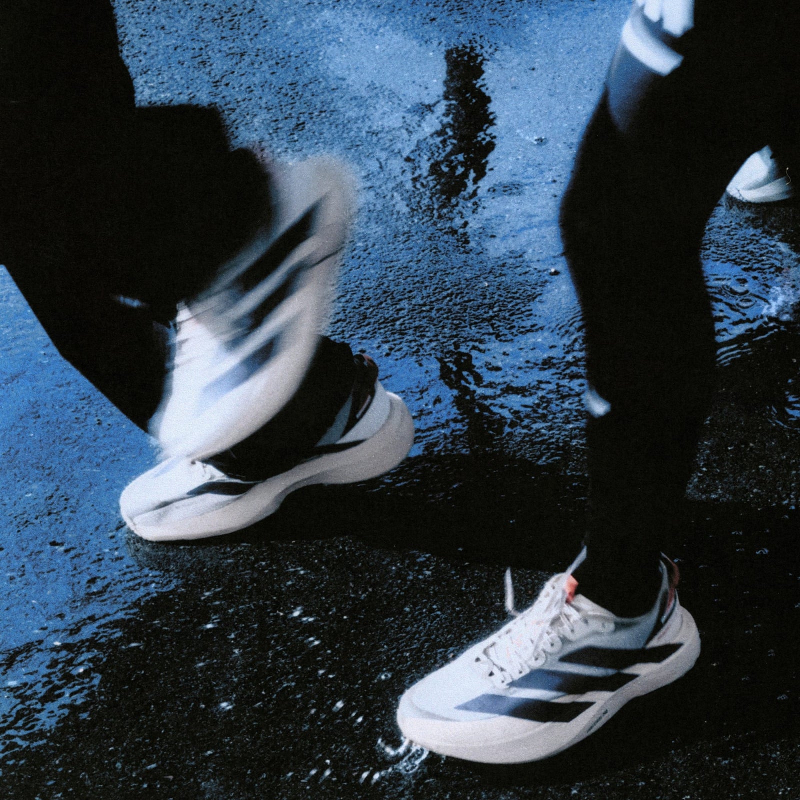 people running in the rain in adidas adizero evo sl atr run shoe

