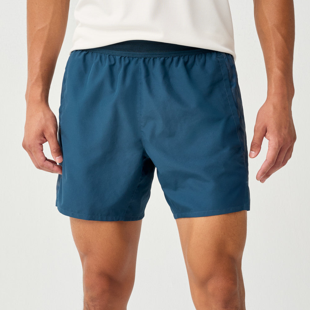 Man wearing Brooks Dash Reflective Shorts, showing front