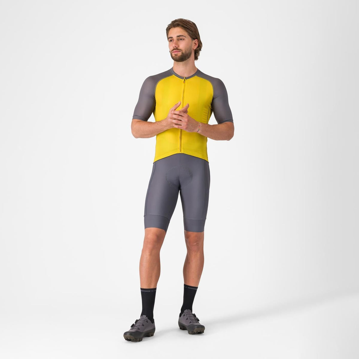 Man wearing Castelli Unlimited Endurance 3 Cycling Jersey in grey and yellow