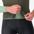 man wearing castelli espresso vest for wind protection while cycling, dark green colour, showing zip feature