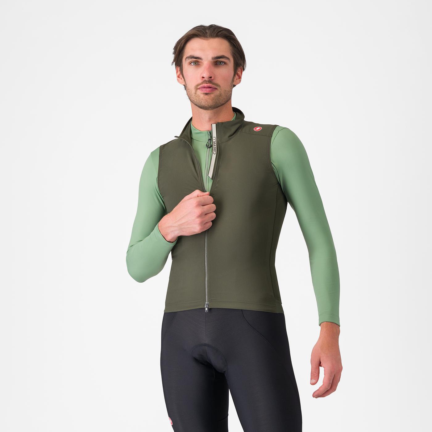 man wearing castelli espresso vest for wind protection while cycling, dark green colour