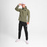 Man wearing SAYSKY clean hooded jacket for road running in beige colour