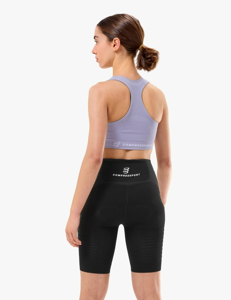 Woman wearing a lavender compressport sports bra and shorts with small logo in corner