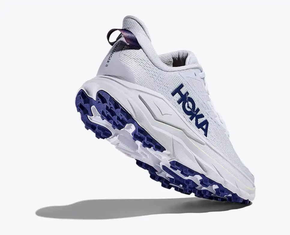 Bottom view of white and blue hoka womens challenger 8 trail runner