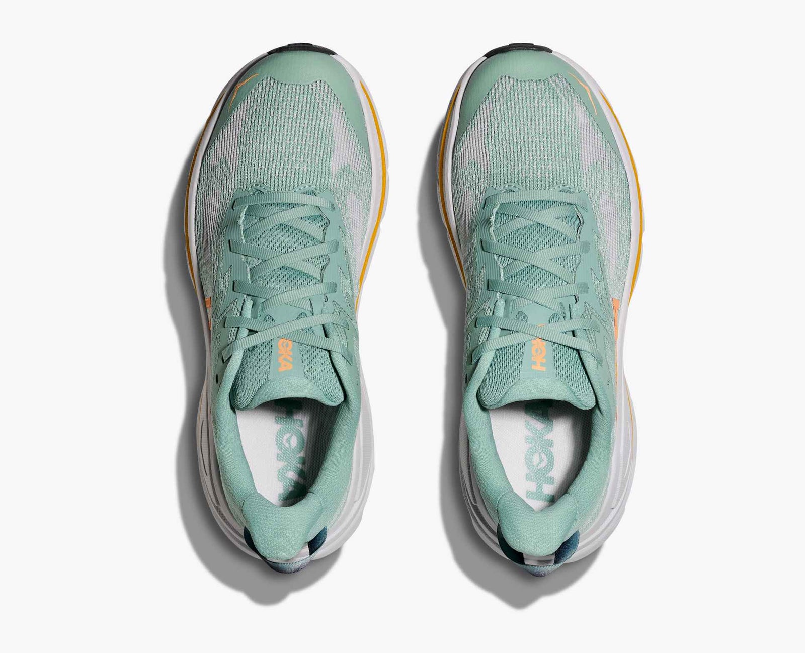 Pair of green hoka challenger 8 running shoe with yellow detail
