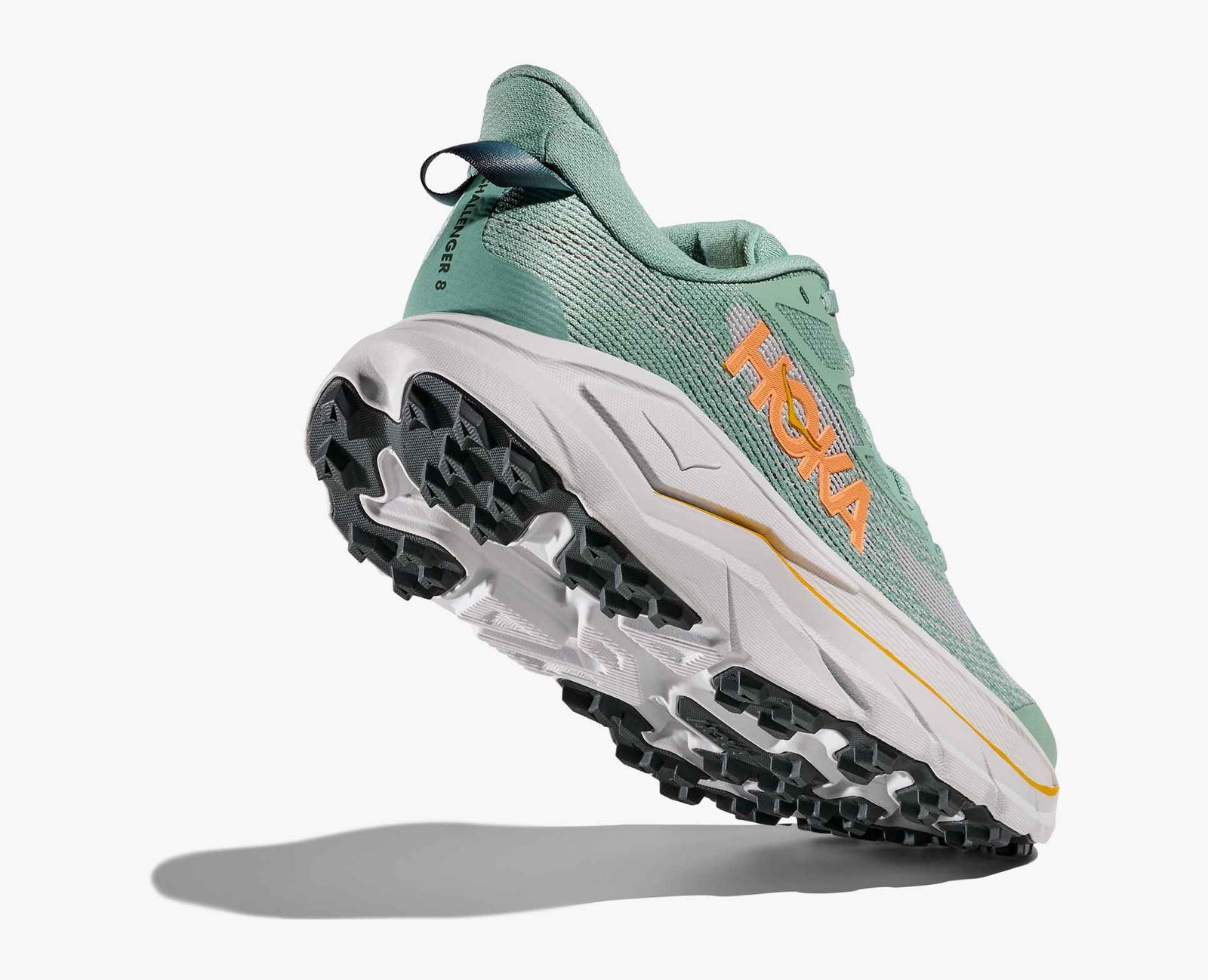 Green hoka challenger 8 running shoe with yellow logo and black grip 