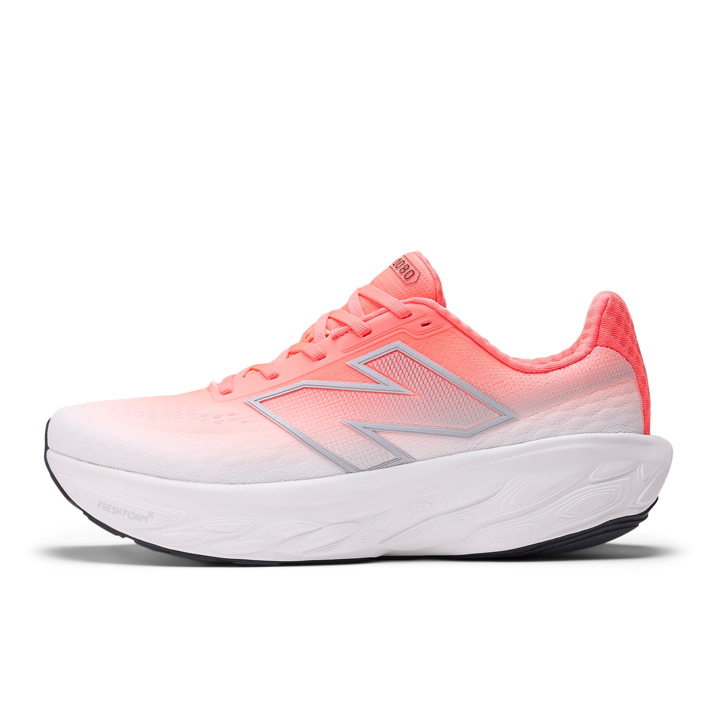 Red and white running shoe with New Balance logo on a white background