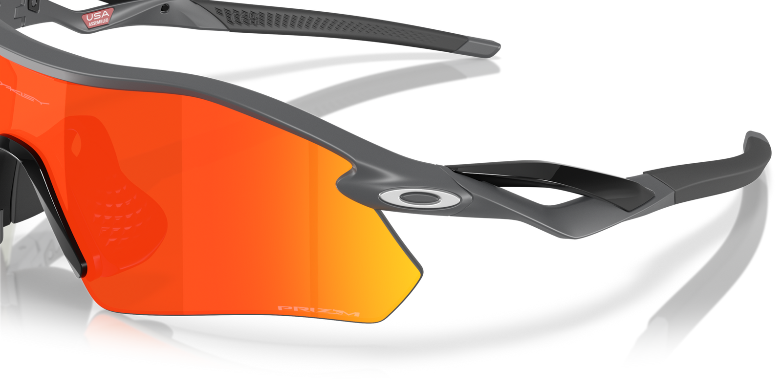 Oakley radar plate prizm ruby lenses matte carbon frame close up on lens