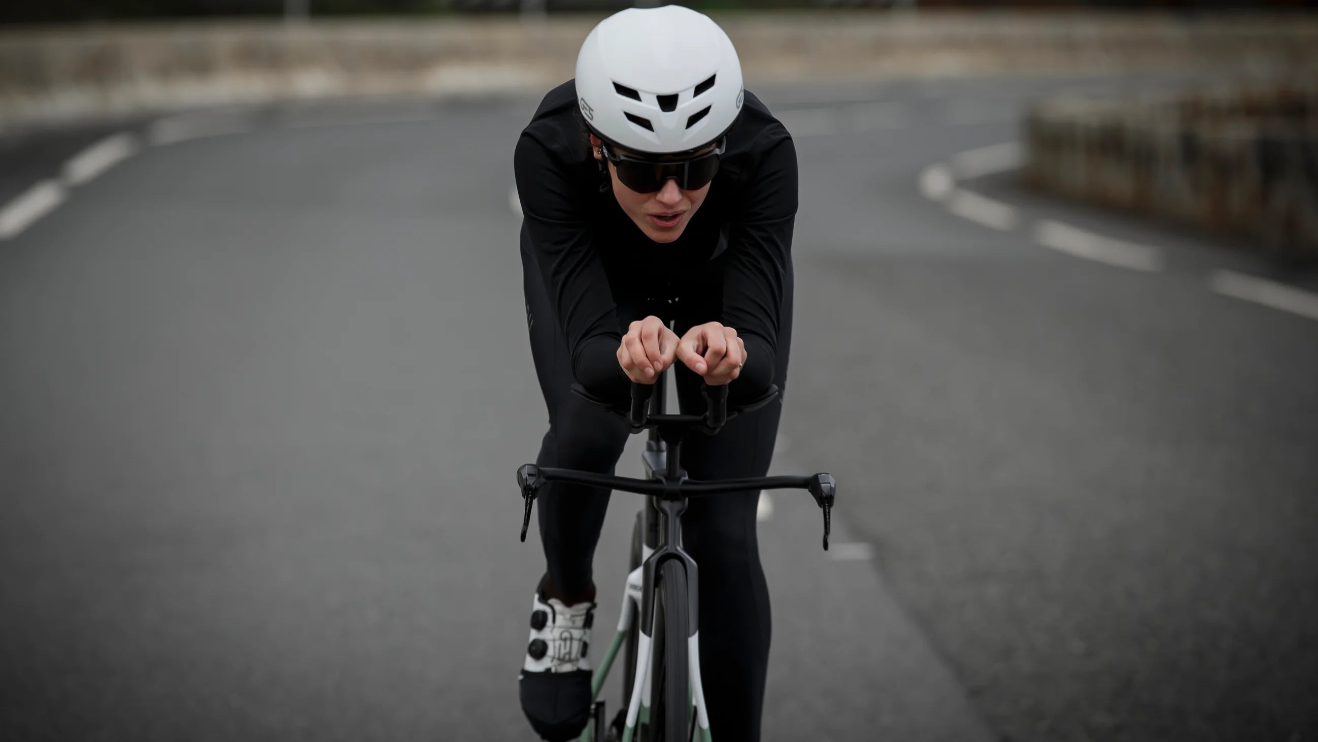 woman cycling orbea ordu triathlon bike on a road