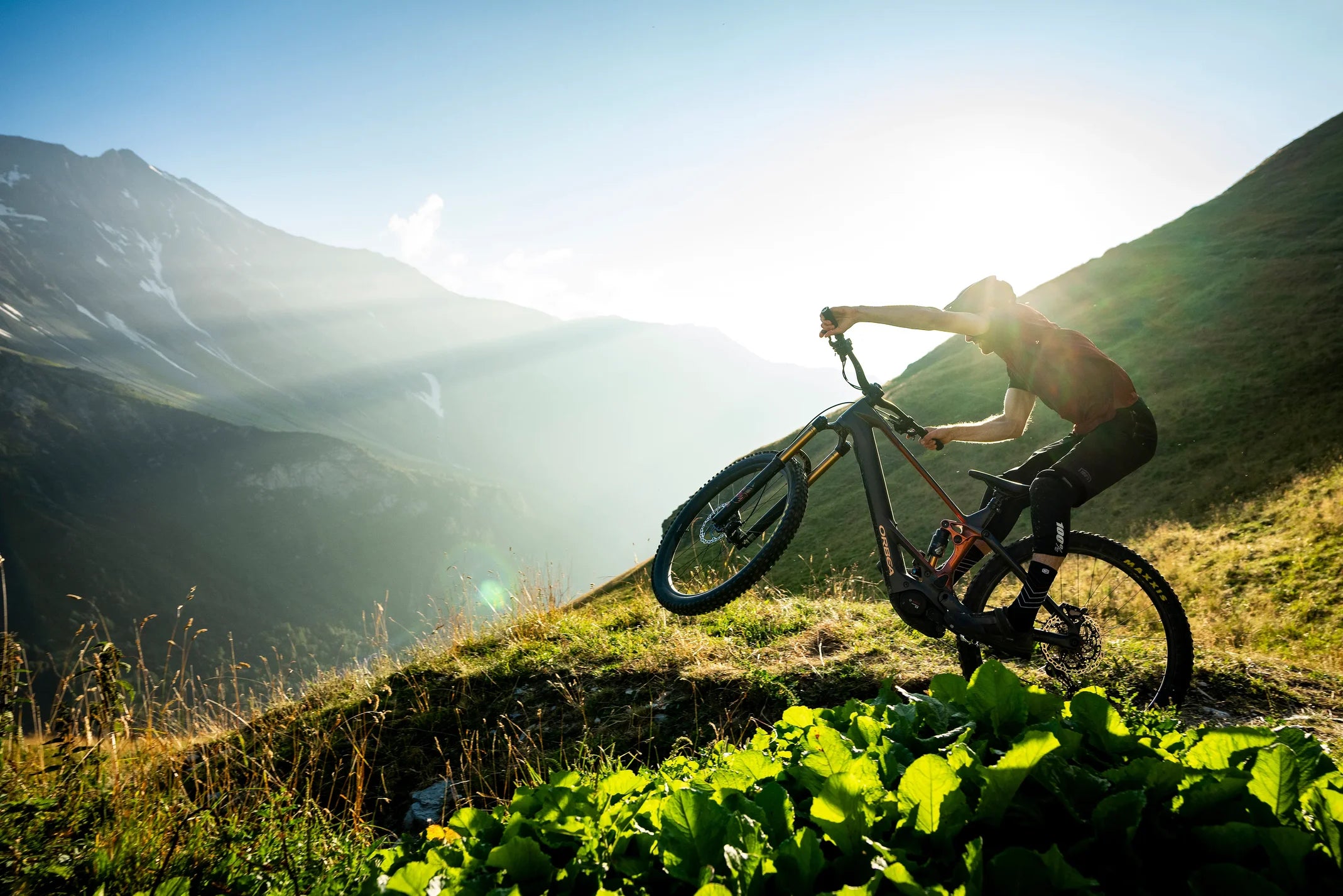 man mountain biking on an orbea wild electric mtb