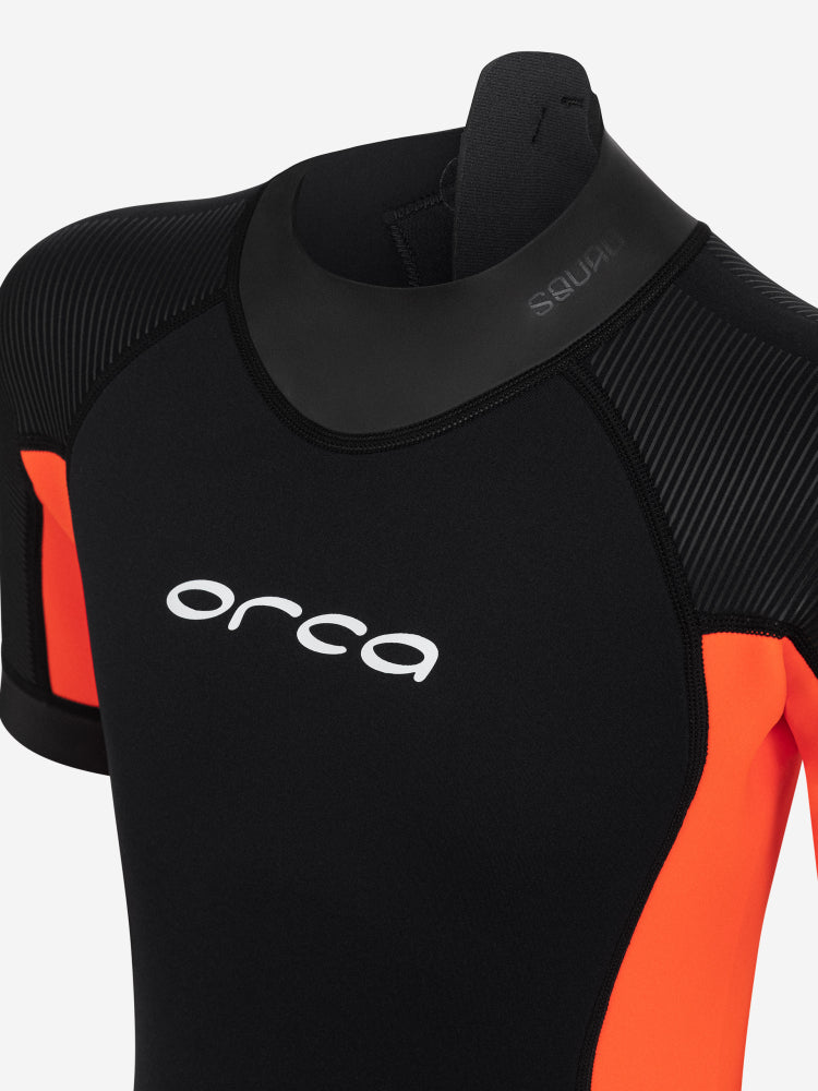 Black and orange orca vitalis squad shorty junior wetsuit with short sleeve and short legs