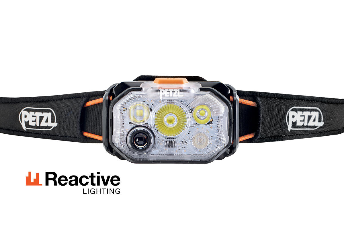 Petzl headtorch with reactive lighting , 1200 lumens in black and orange