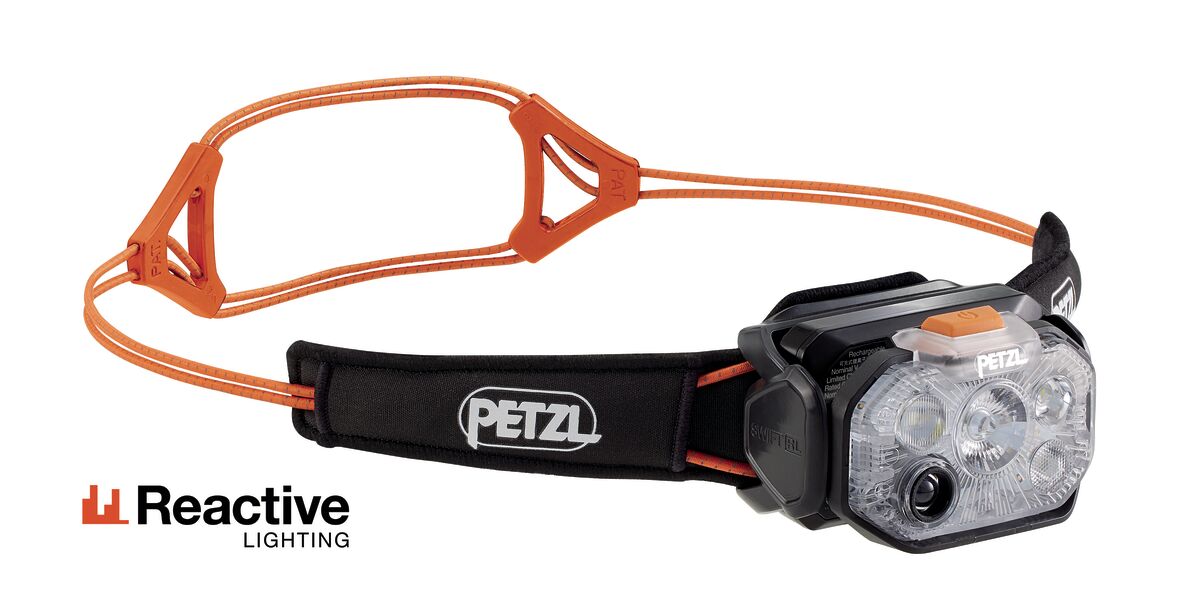 Petzl headtorch with reactive lighting , 1200 lumens in black and orange