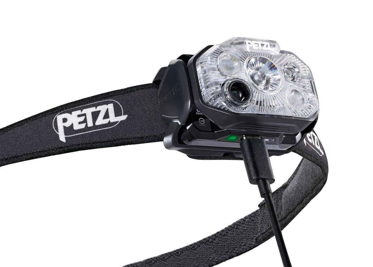 Petzl headtorch for running with reactive lighting in black with charging cable