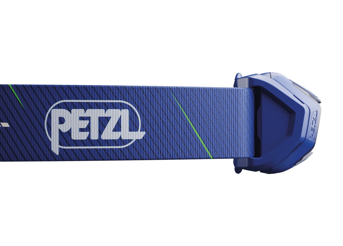 Blue Petzl headlamp on a white background