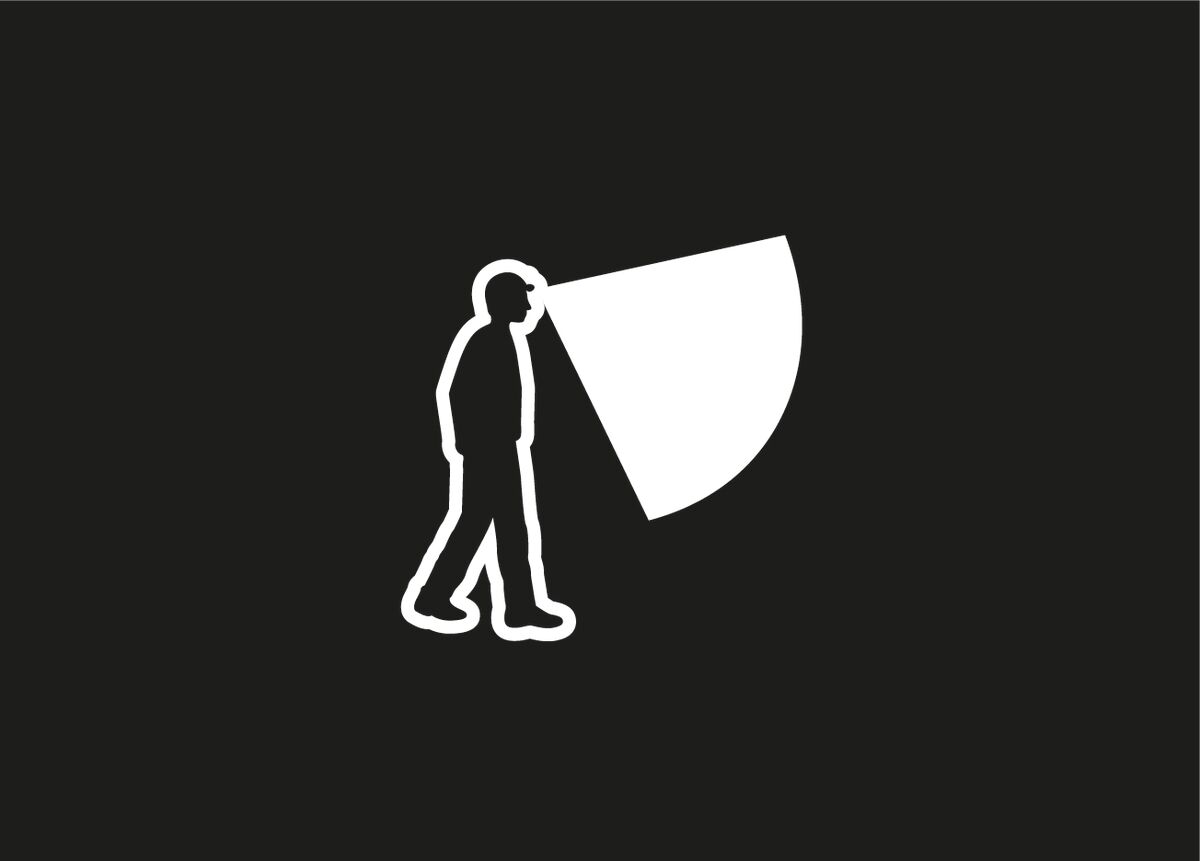 White silhouette of a person with a flashlight on a black background