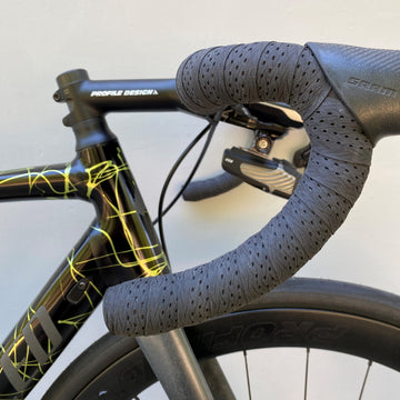 picture of profile design race handlebar tape in a black colour on a handlebar with bike