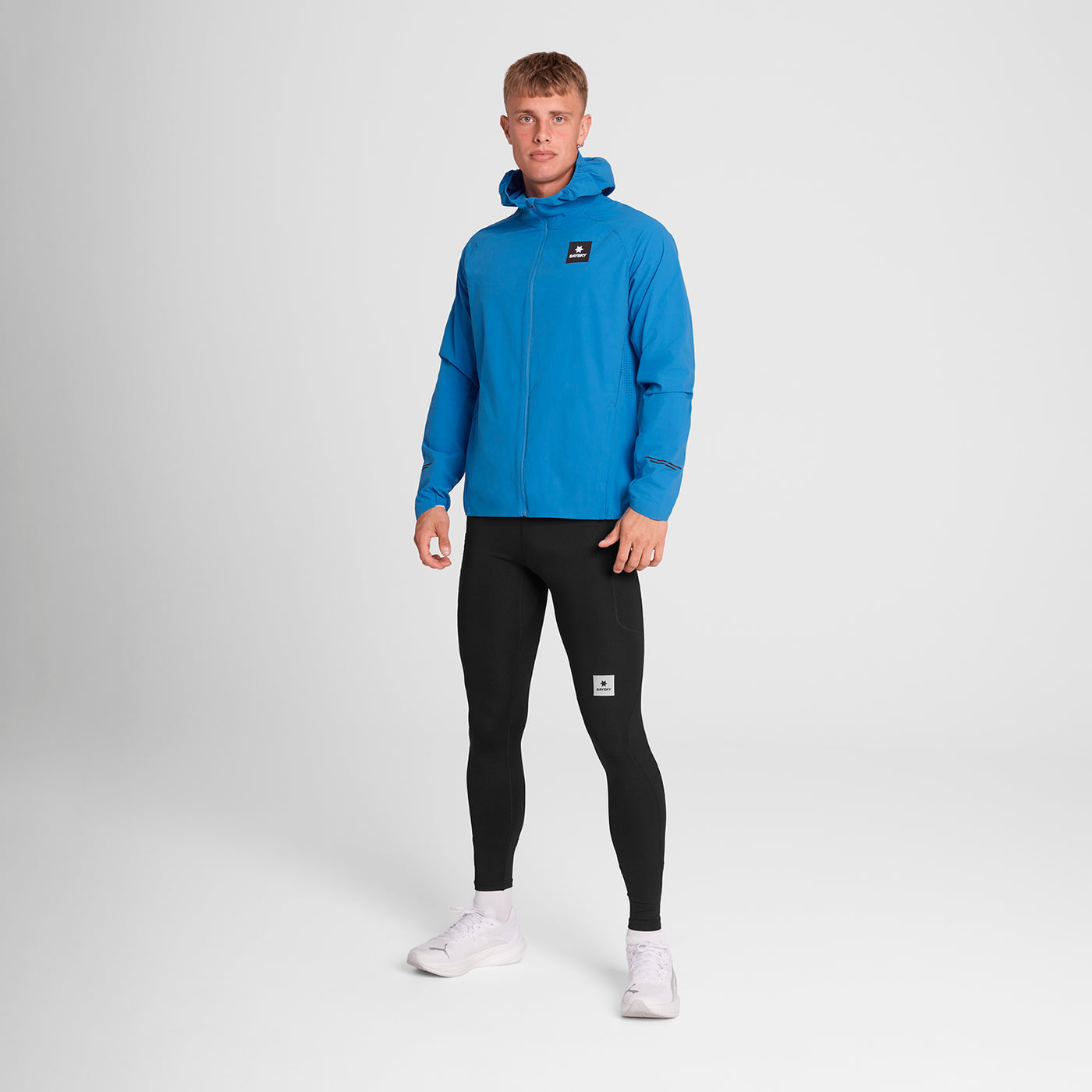 Man wearing SAYSKY Clean Pace Flex Hooded Running Jacket in blue