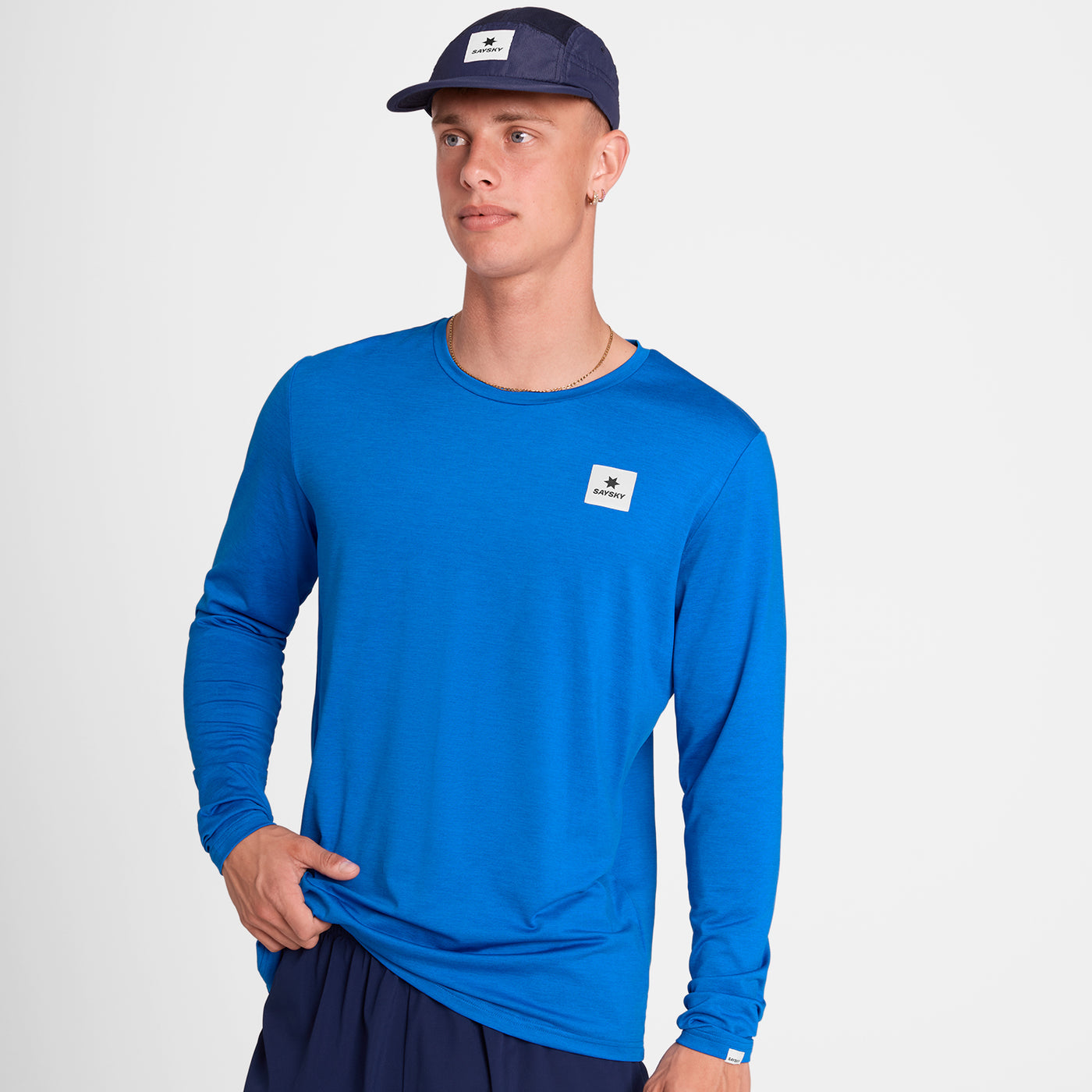 Man wearing SAYSKY Clean Pace long sleeve run top in blue