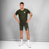 man wearing SAYSKY combat 9 inch run shorts in green