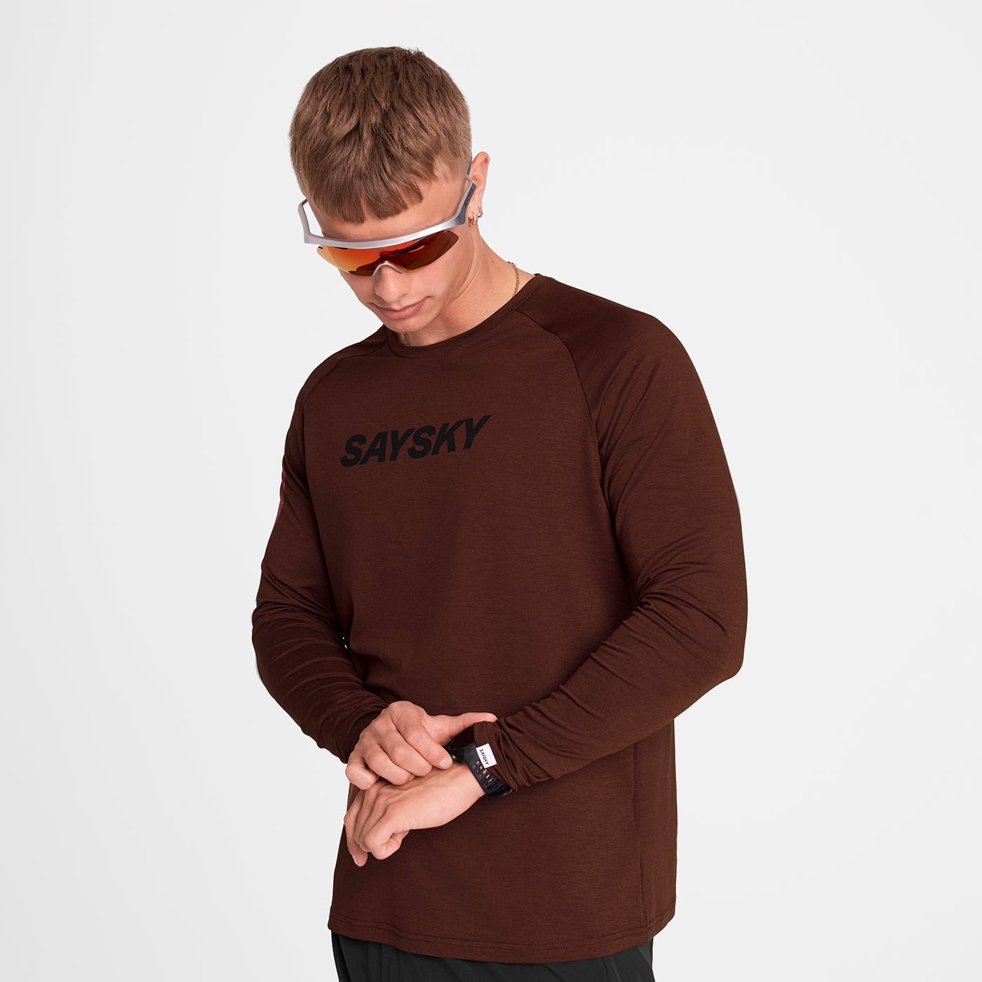 Man wearing SAYSKY Logo Pace Long Sleeve run top, Red Colour