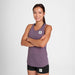Woman wearing purple saysky run tank, reactive flow singlet