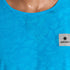 Close up of Blue SAYSKY Reactive run tee shirt, that throws out a flower pattern when wet