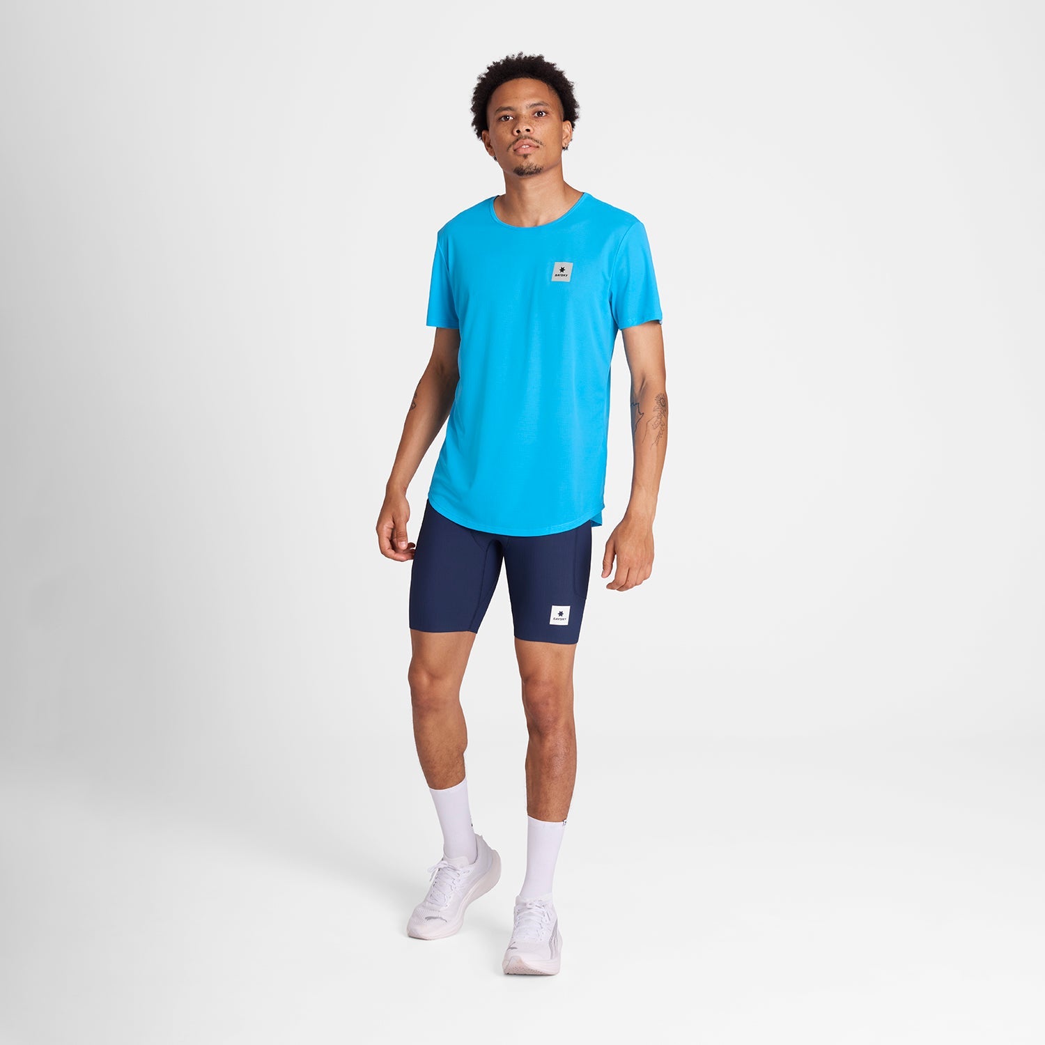 Man wearing Blue SAYSKY run tee shirt with small logo on front