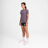 Woman wearing SAYSKY reactive women's run tee, purple colour, 