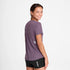 Woman wearing SAYSKY reactive women's run tee, purple colour, with saysky star logo in small on back