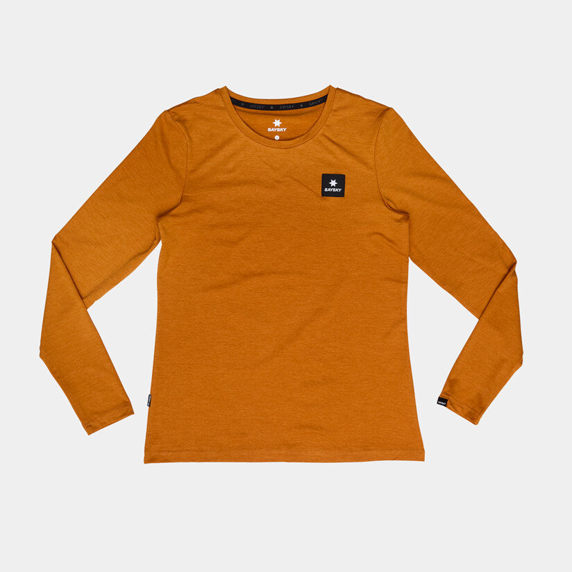Orange SAYSKY long sleeve Pace run top for women, laid out flat