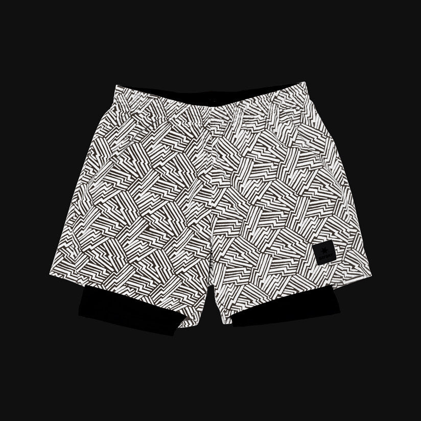 SAYSKY reflective 2in1 Pace running shorts for men, showing them lit up in dark