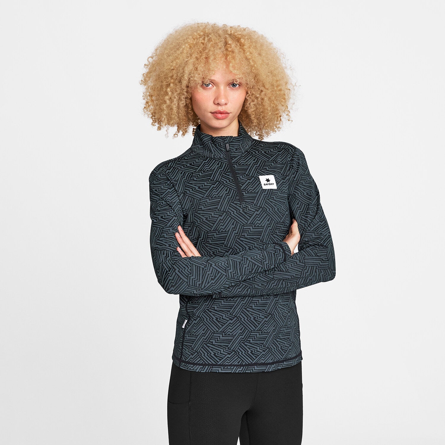 Woman wearing Reflective Pace 1/2 Zip Long Sleeve in black