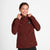 Woman wearing SAYSKY Clean Pace Shield Running Jacket in red colour