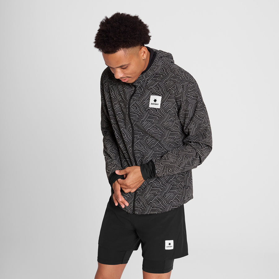 saysky reflective blaze jacket for men, warm wind proof jacket for running in cold dark conditions, black with grey reflective geometric pattern, man wearing saysky reflective jacket moving sleeve cuff