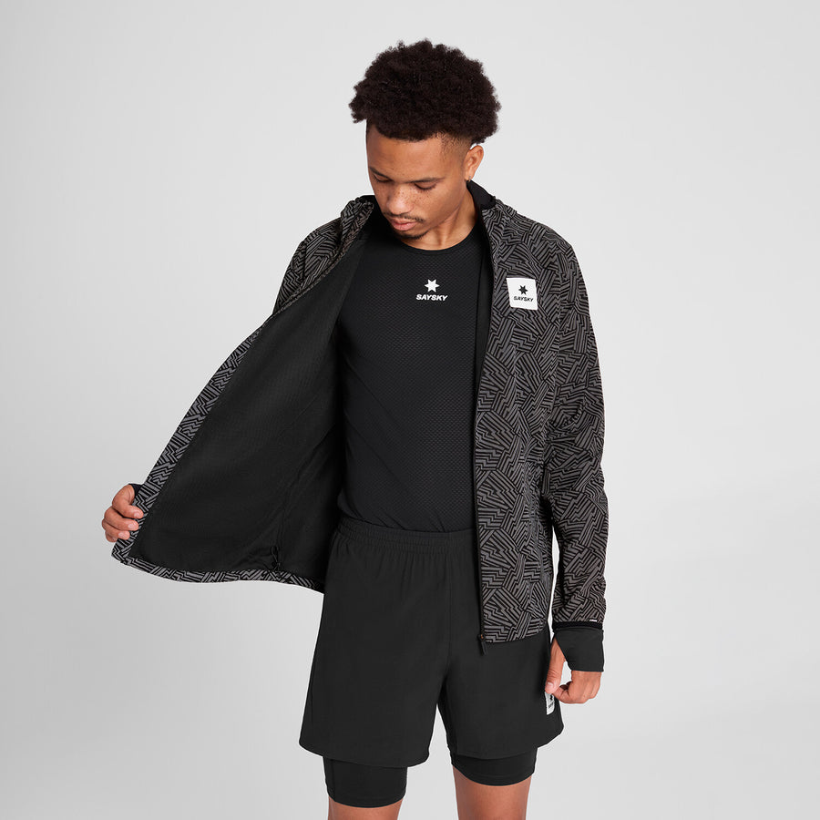 saysky reflective blaze jacket for men, warm wind proof jacket for running in cold dark conditions, black with grey reflective geometric pattern, man wearing saysky reflective jacket with focus on black inner mesh material