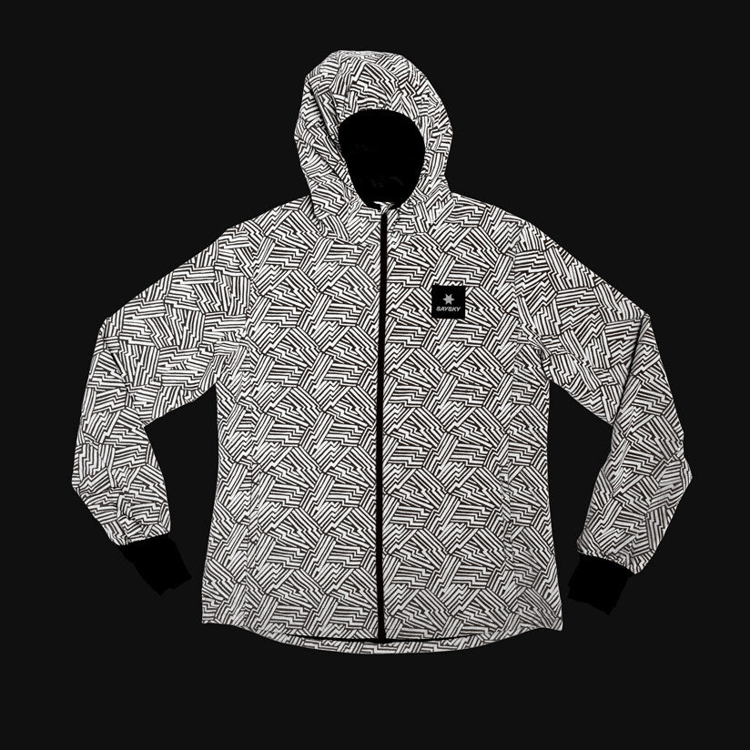 Women's SAYSKY reflective blaze jacket in orange colour, showing how it reflects in the dark