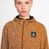 Woman wearing SAYSKY reflective blaze jacket in orange colour, showing close up of zip, logo and fabric